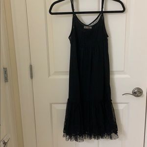 Rye black slip dress with ruffled lace.